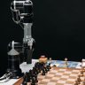 Robotic arm making a strategic move on a chessboard, showcasing AI in games.