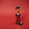Golden trophy standing on a vibrant red background, symbolizing success and achievement.