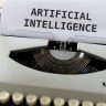 A close-up of a typewriter showcasing 'ARTIFICIAL INTELLIGENCE' on paper.