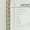 Top view of a minimalist schedule planner with Monday header. Perfect for organizing daily tasks with goals section.